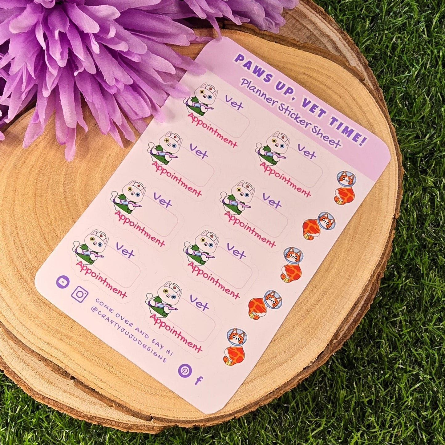 Sticker sheet with vet-themed designs on a wooden board with purple flowers.