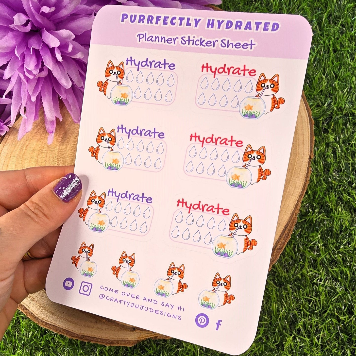 Planner sticker sheet with hydration reminders and cartoon cat on a grassy background
