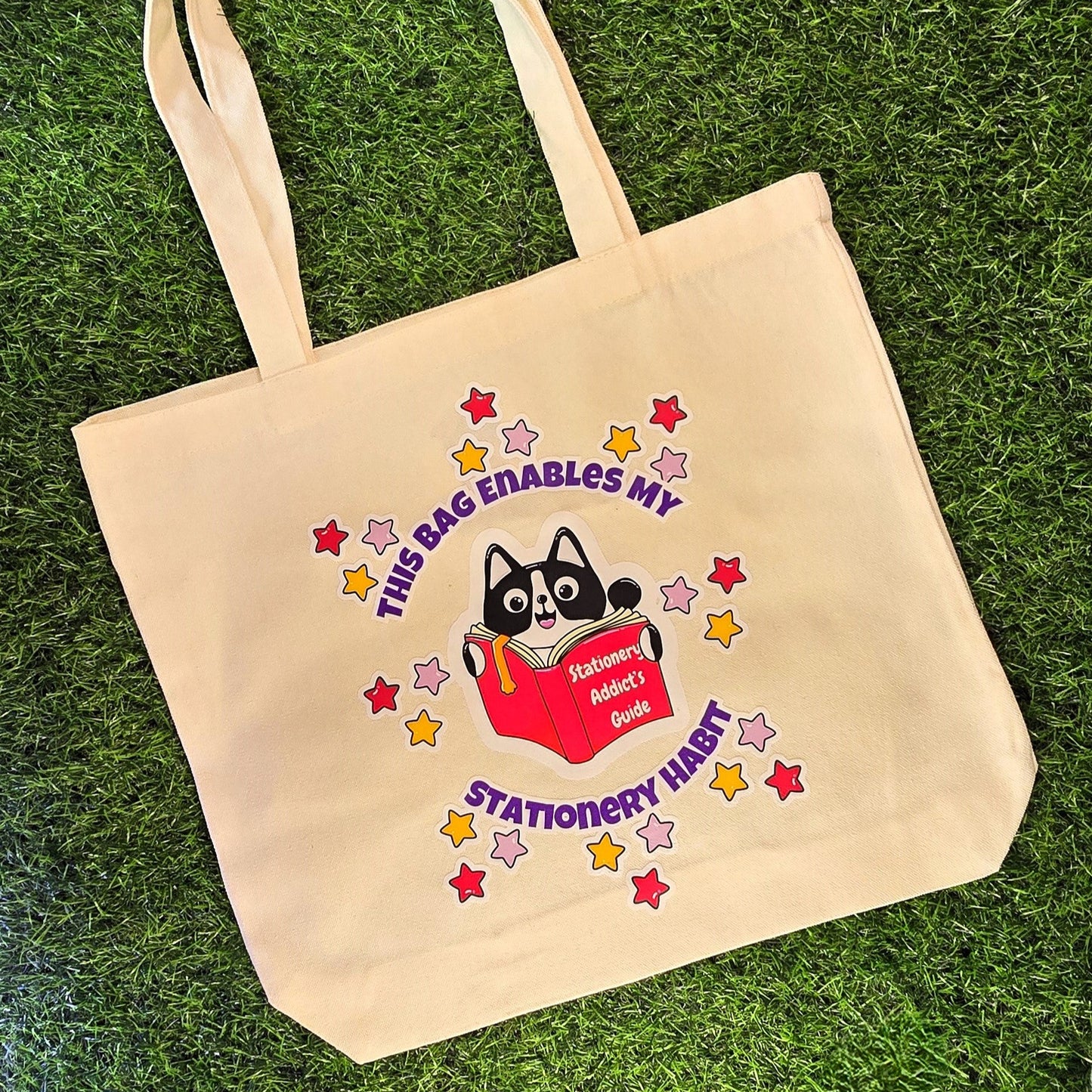 This Bag Enables My Stationery Habit – Cream Cotton Tote Bag with Cat & Book Illustration | DTF Print Eco Shopper for Stationery Addicts