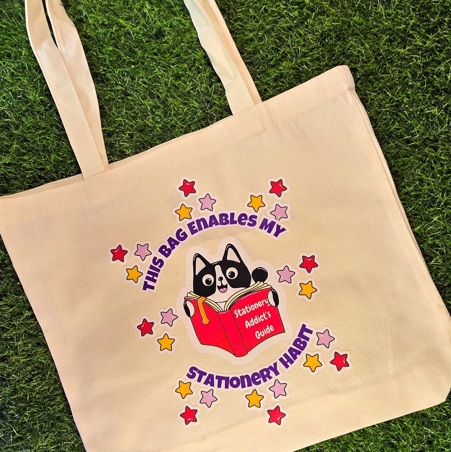 This Bag Enables My Stationery Habit – Cream Cotton Tote Bag with Cat & Book Illustration | DTF Print Eco Shopper for Stationery Addicts