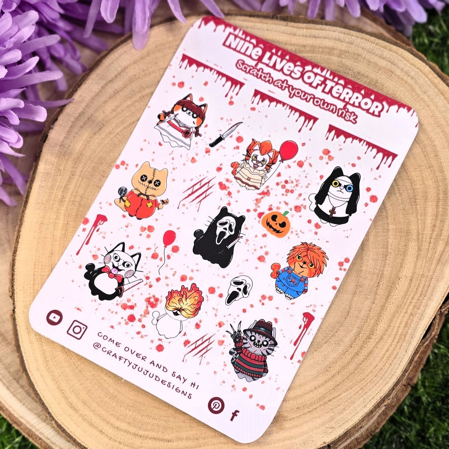 Sheet of stickers with cartoon characters on a wooden surface with purple flowers in the background