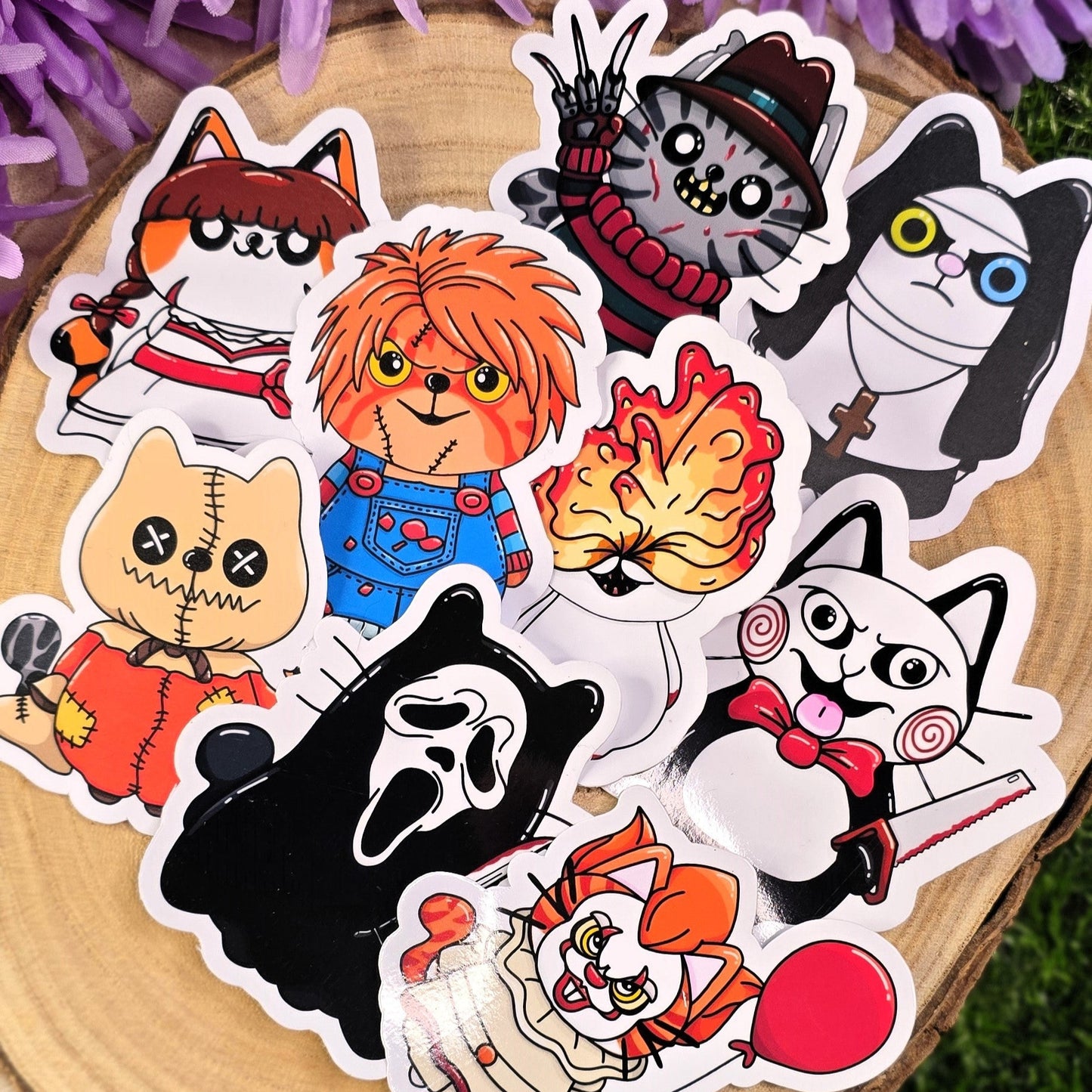 Set of cartoon character stickers on a wooden surface with purple flowers in the background