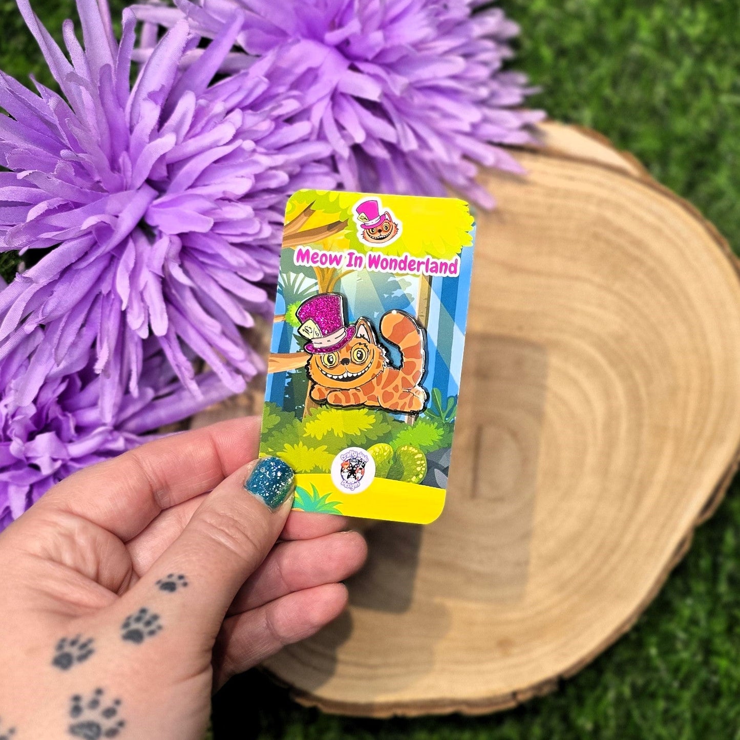 Cheshire cat enamel pin with purple glitter hat