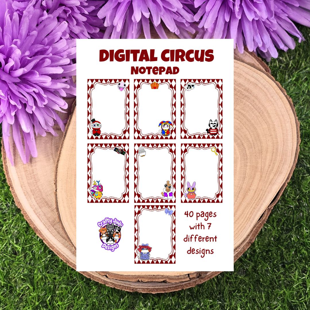 Digital Circus Notepad with cartoon characters on a wooden surface with purple flowers. The Amazing Digital Purr-cus. The Amazing Digital Cat-cus