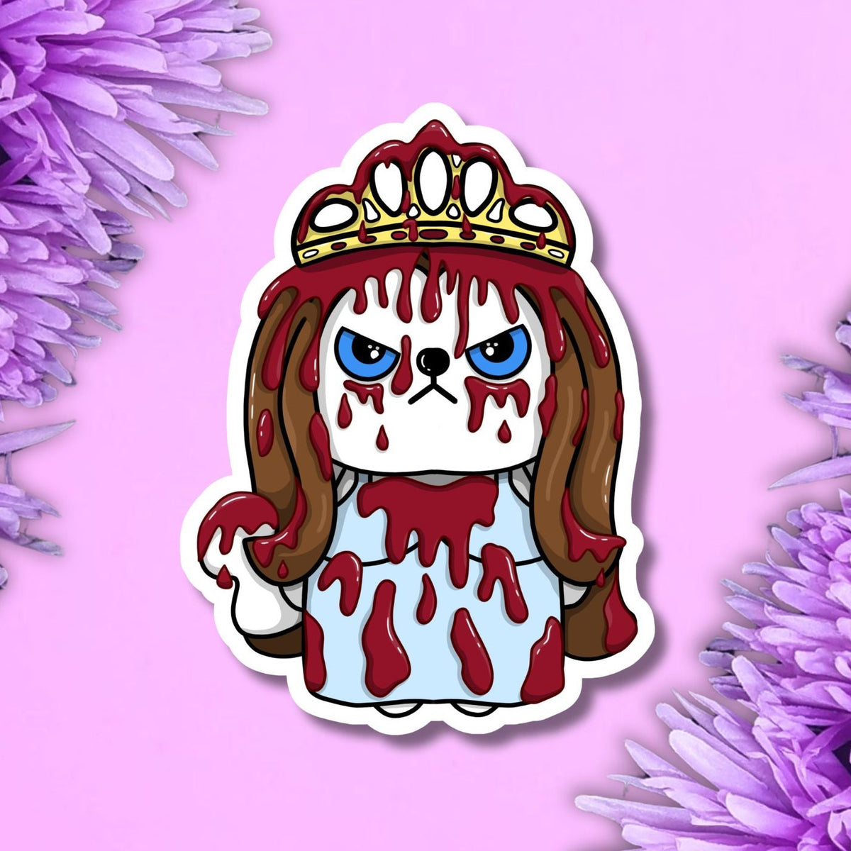 A die-cut sticker featuring a cartoon white cat with blue eyes, brown hair, a gold crown, and red blood-like drips, shown on a pink background with purple flowers at the corners.