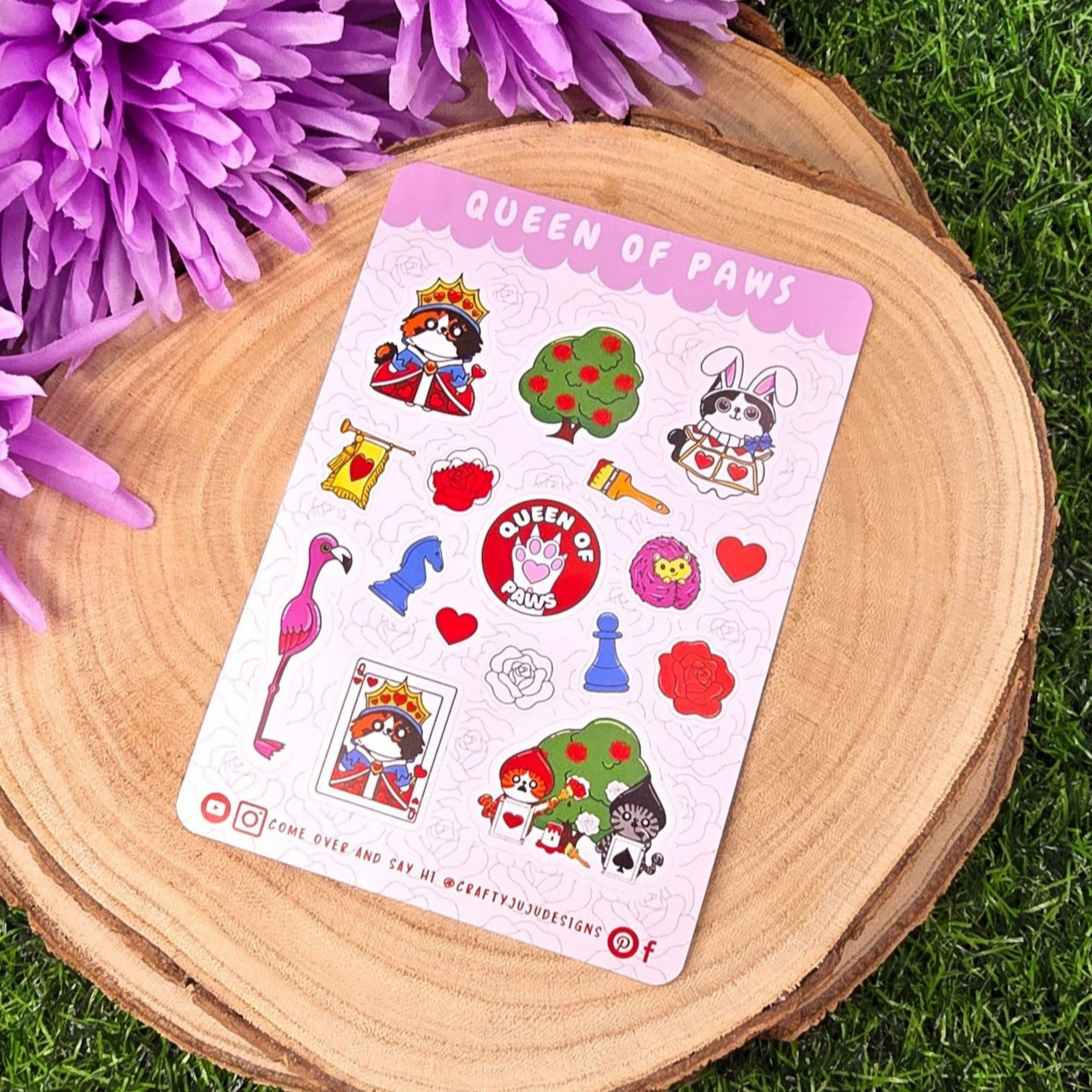Sticker sheet with cartoon characters on a wooden board with purple flowers on grass background