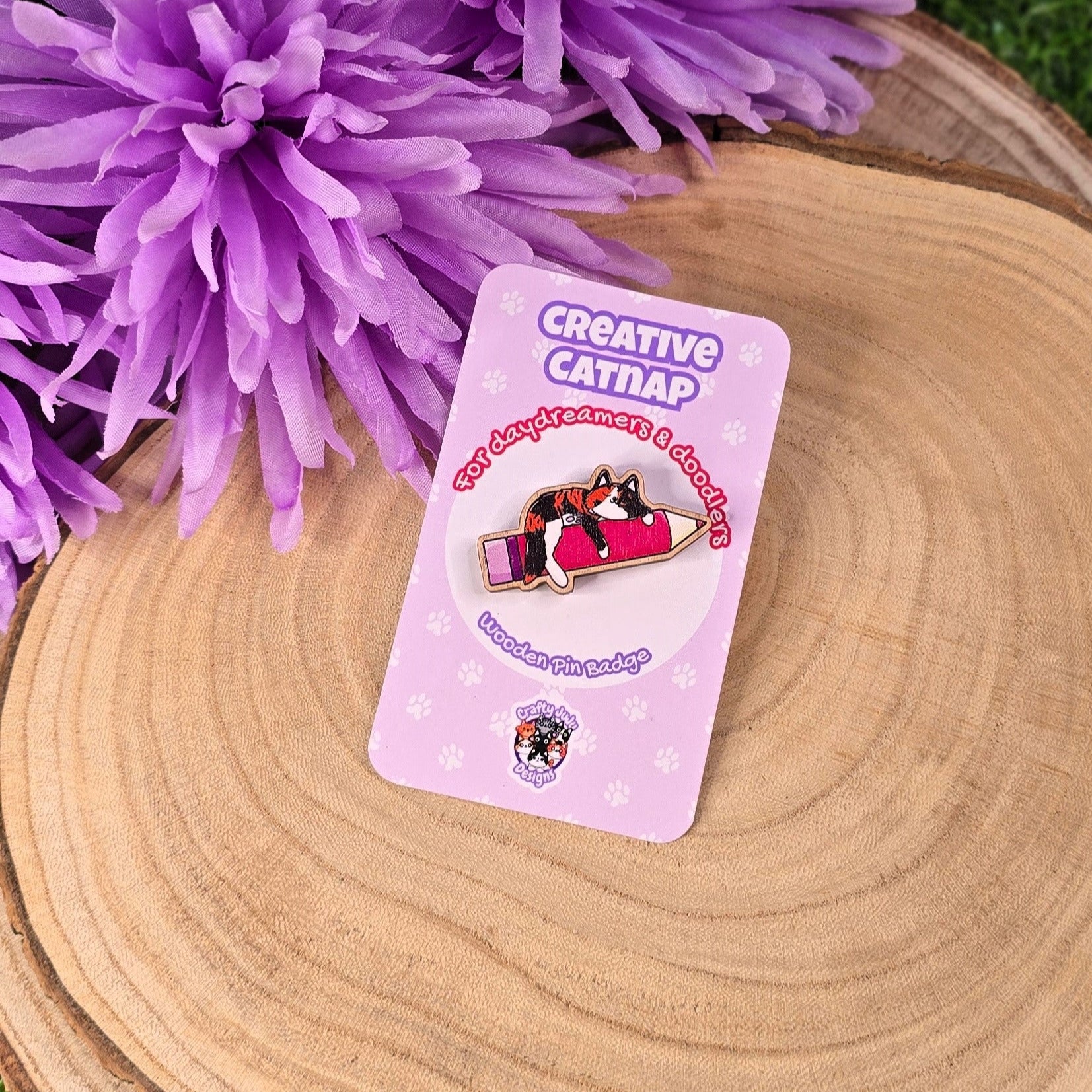 Pin on a card labeled 'Creative Catnap' with purple flowers in the background