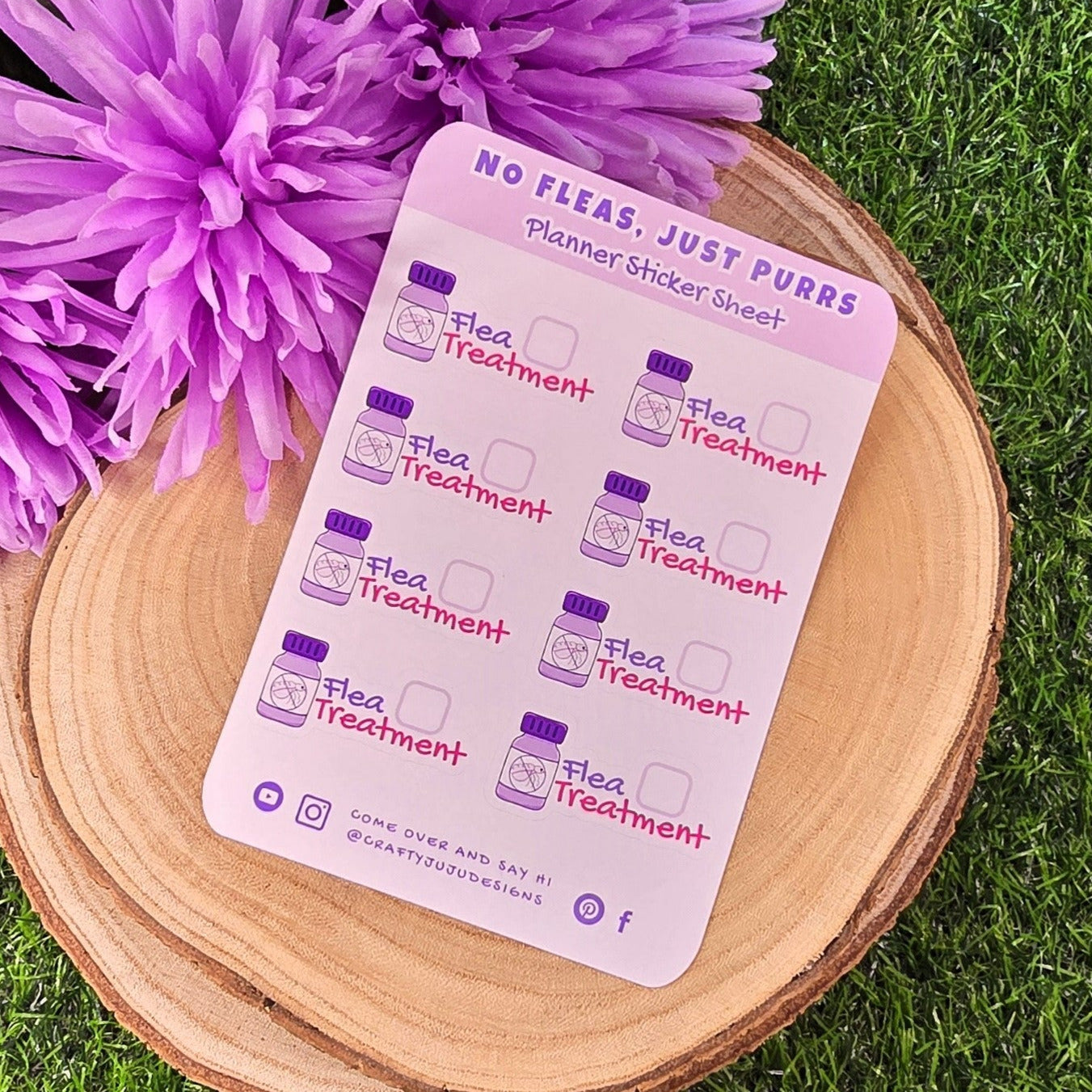 Sticker sheet with pet care illustrations on a wooden surface with purple flowers.