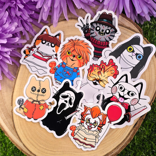 Set of colorful cartoon-style stickers on a wooden surface with purple flowers in the background