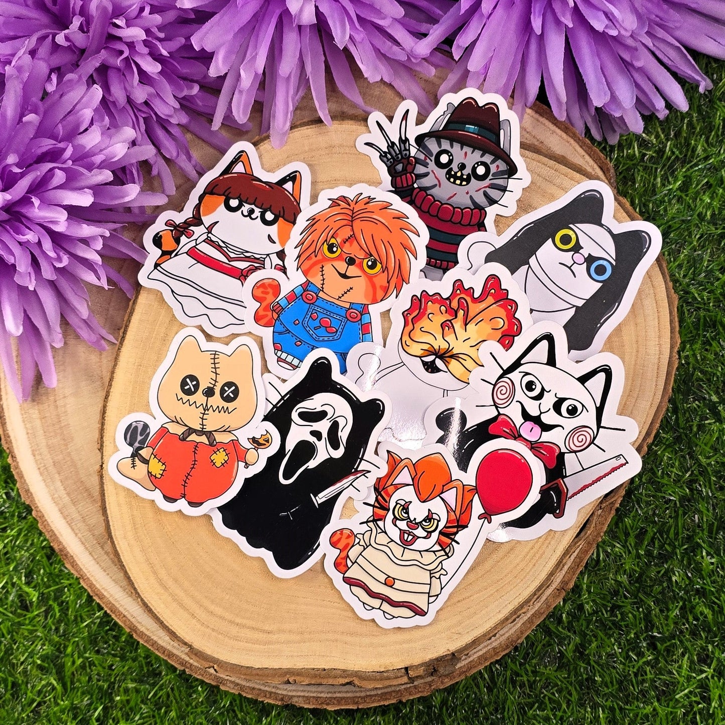 Set of cartoon character stickers on a wooden surface with purple flowers in the background