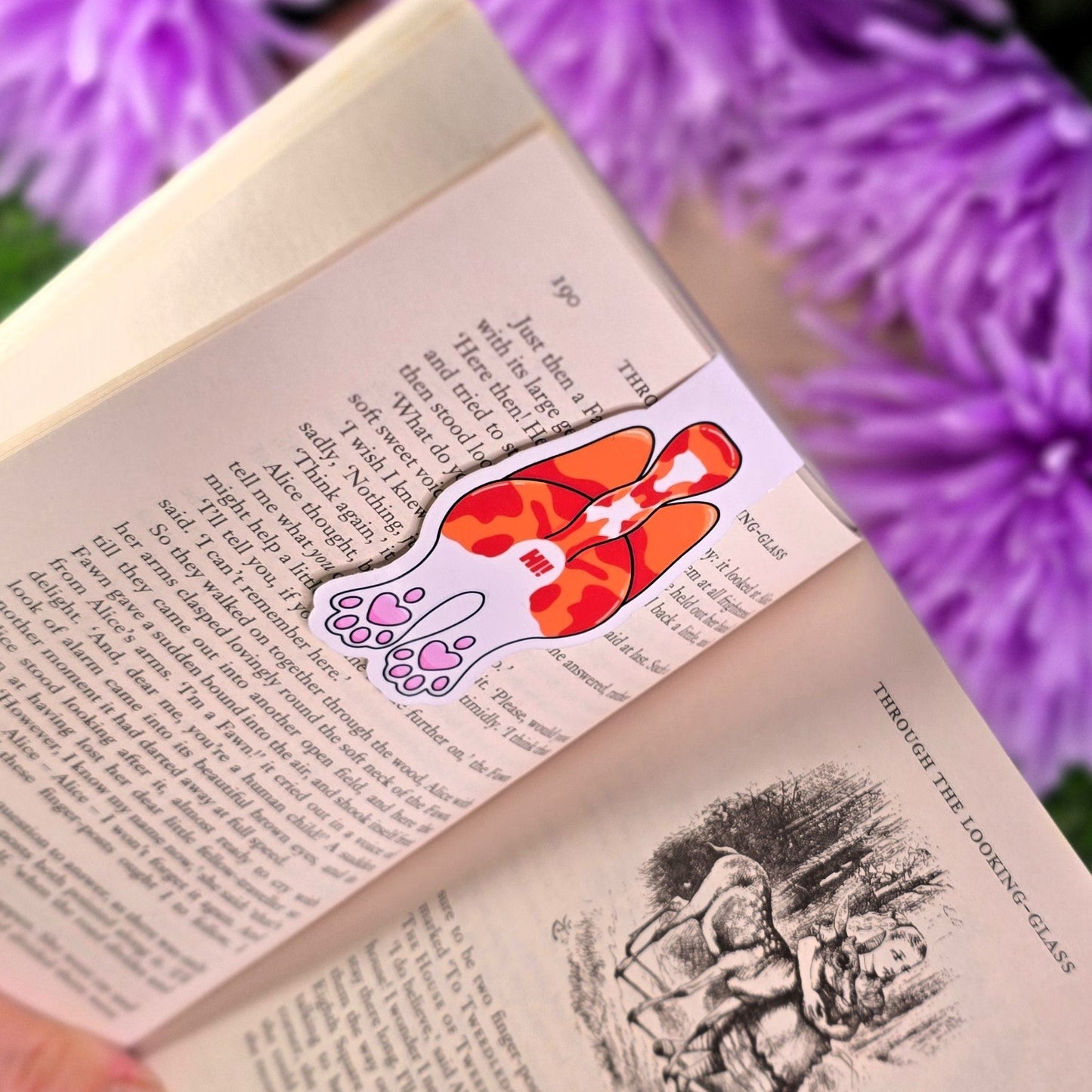 Book with a bookmark featuring cat butt