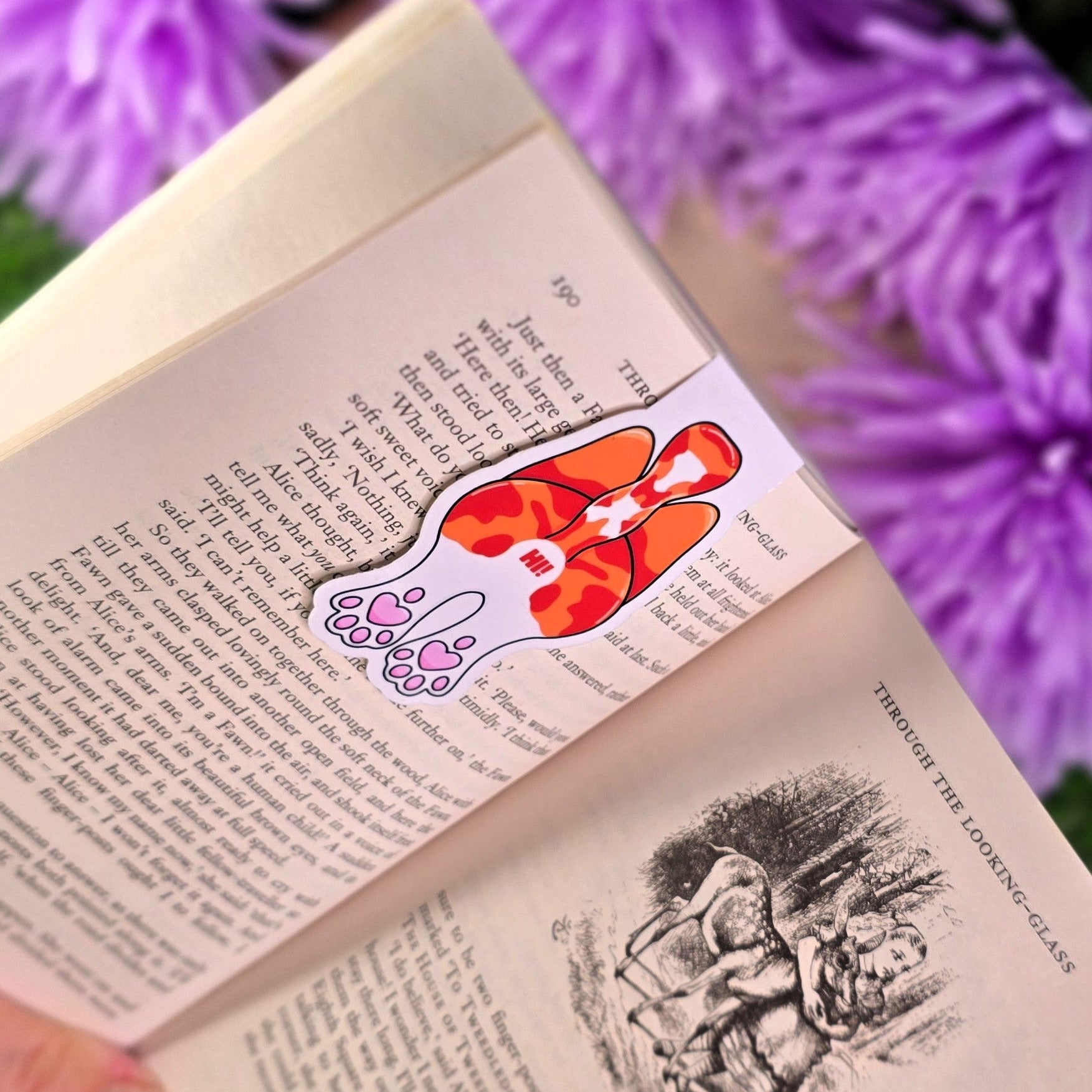 Book with a bookmark featuring cat butt