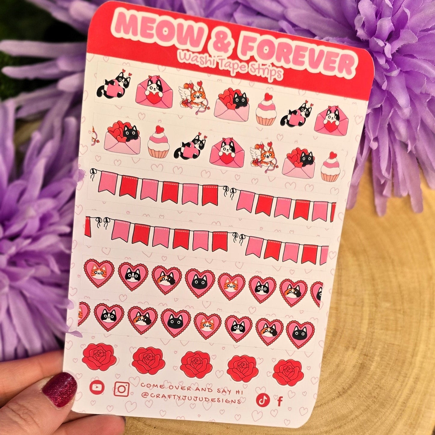 Sticker sheet with 'MEOW & FOREVER' text held over purple flowers