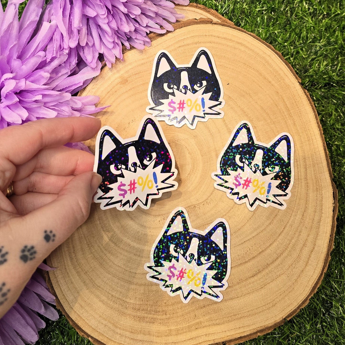 Holographic angry cat sticker with censored swear bubble