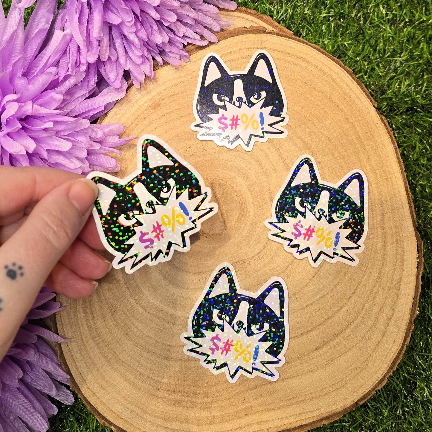 Holographic angry cat sticker with censored swear bubble