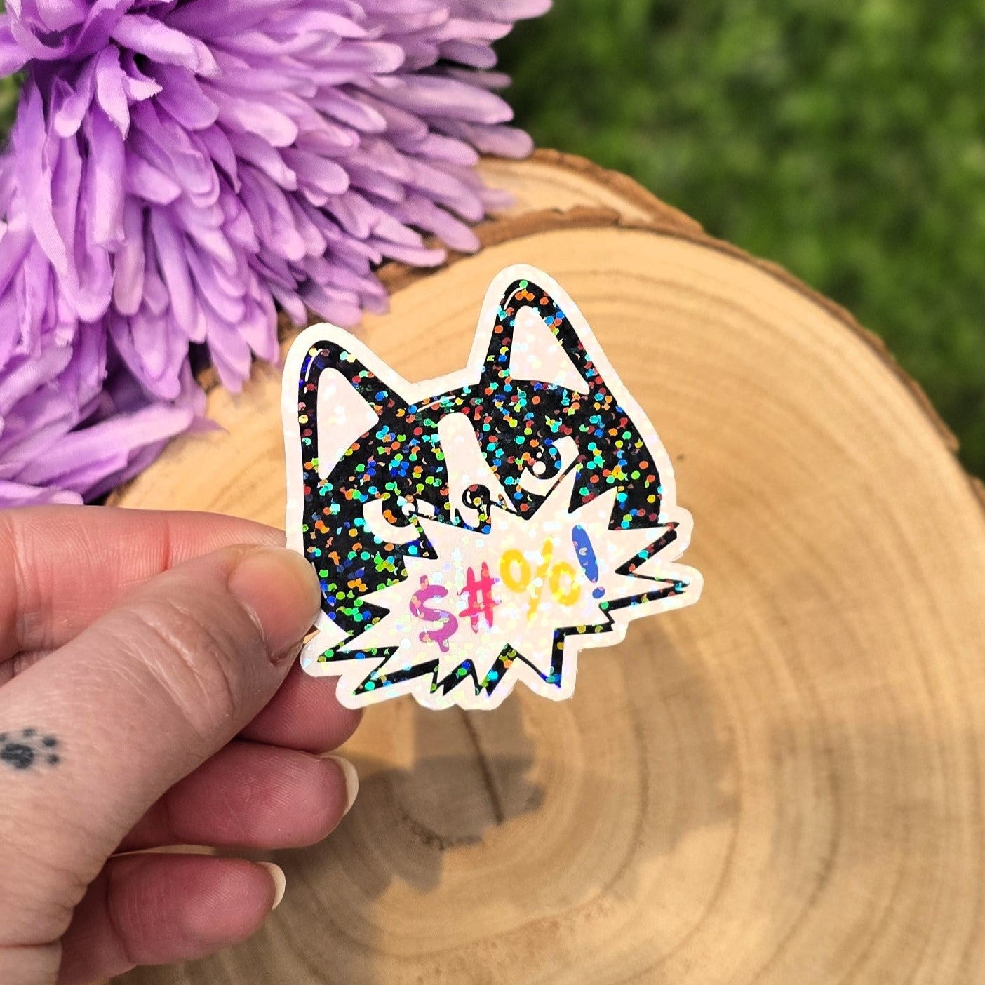 Holographic angry cat sticker with censored swear bubble