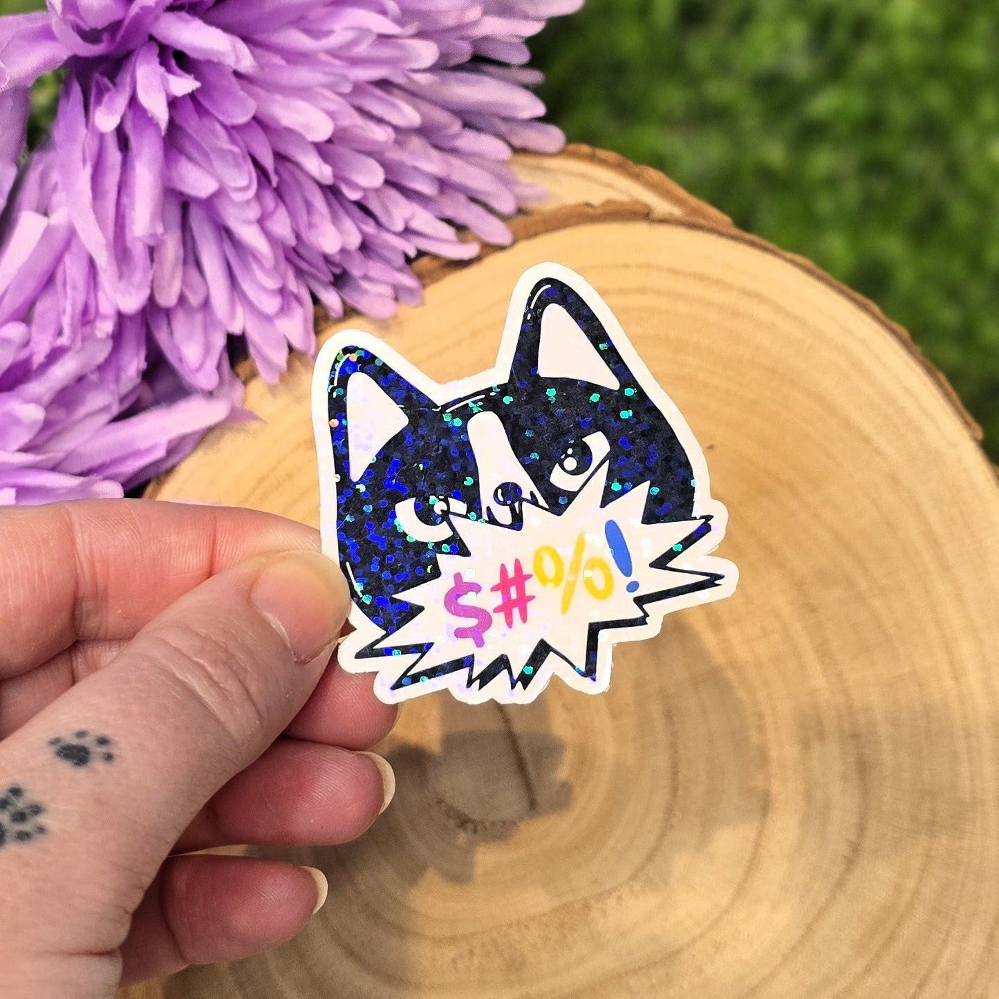 Holographic angry cat sticker with censored swear bubble