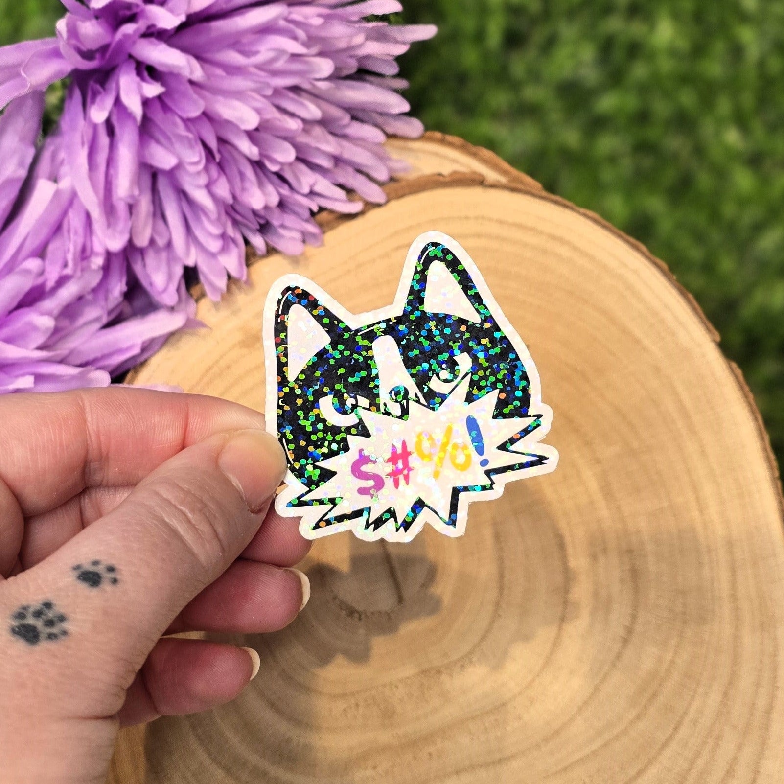 Holographic angry cat sticker with censored swear bubble