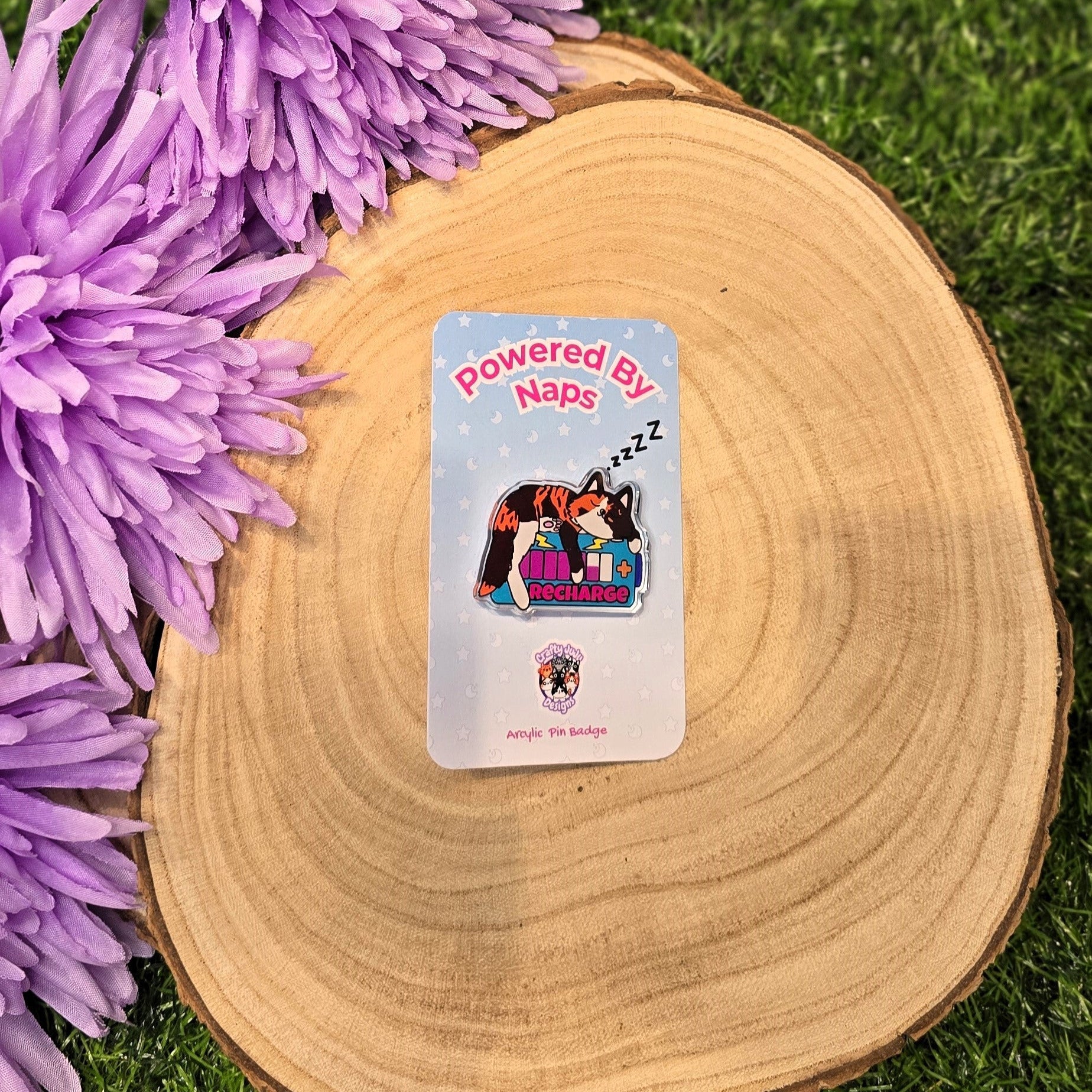 Powered By Naps acrylic pin badge with recharge cat design