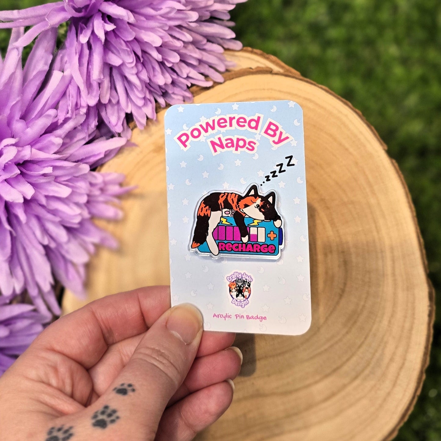 Powered By Naps acrylic pin badge with recharge cat design