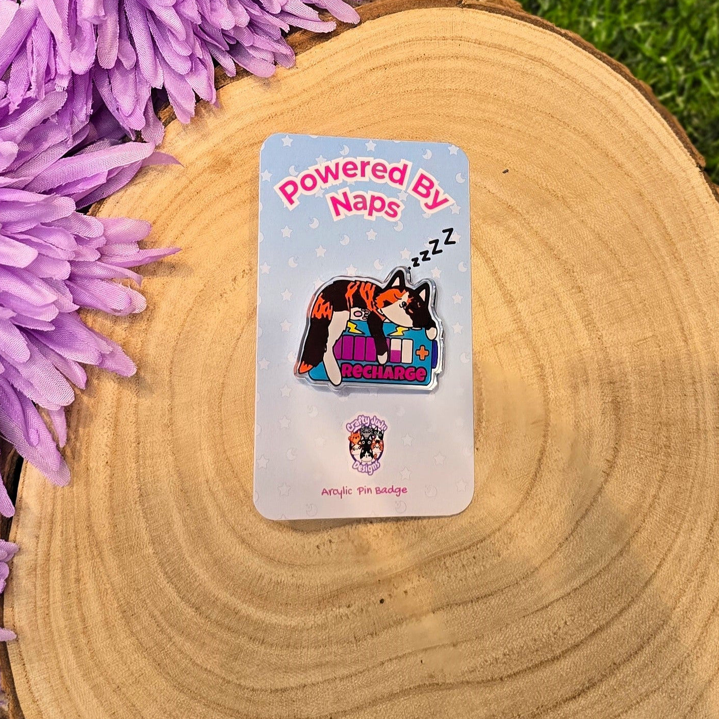 Powered By Naps acrylic pin badge with recharge cat design