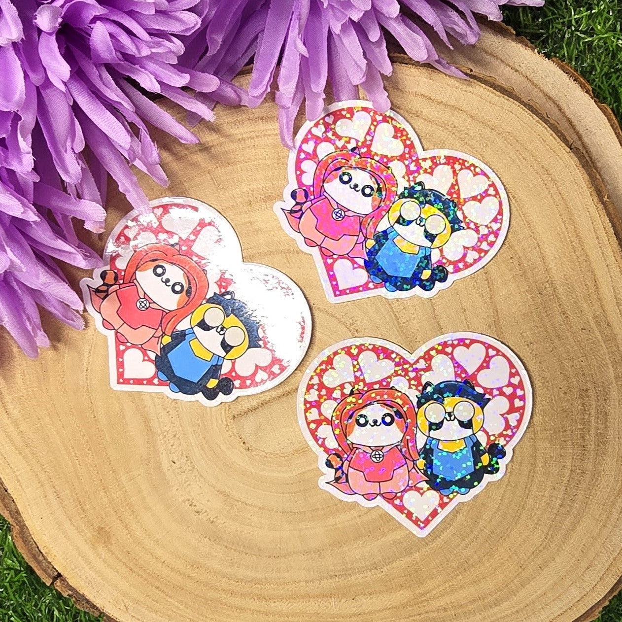 Holographic superhero power couple cat vinyl sticker with heart surround, comic inspired die cut waterproof handmade sticker 6cm UK
