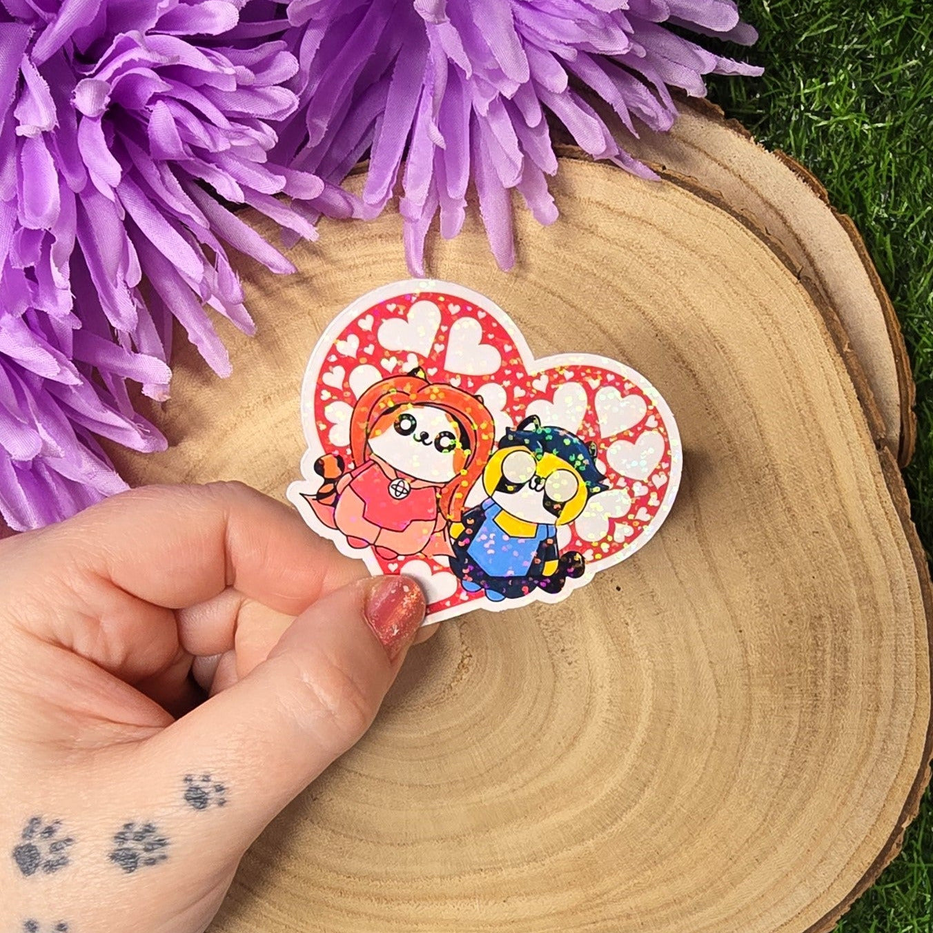 Holographic superhero power couple cat vinyl sticker with heart surround, comic inspired die cut waterproof handmade sticker 6cm UK