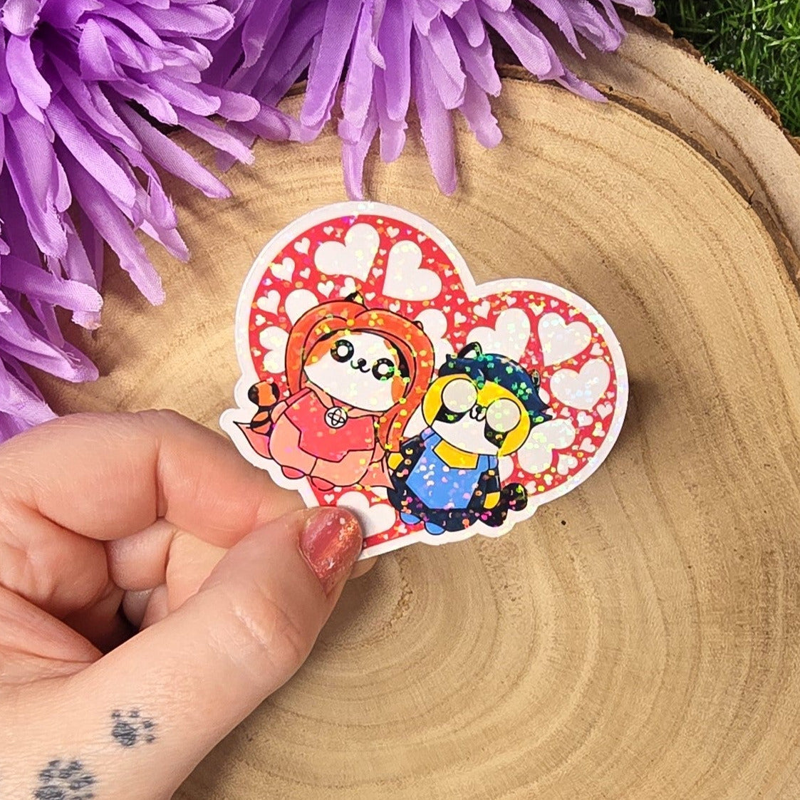 Holographic superhero power couple cat vinyl sticker with heart surround, comic inspired die cut waterproof handmade sticker 6cm UK