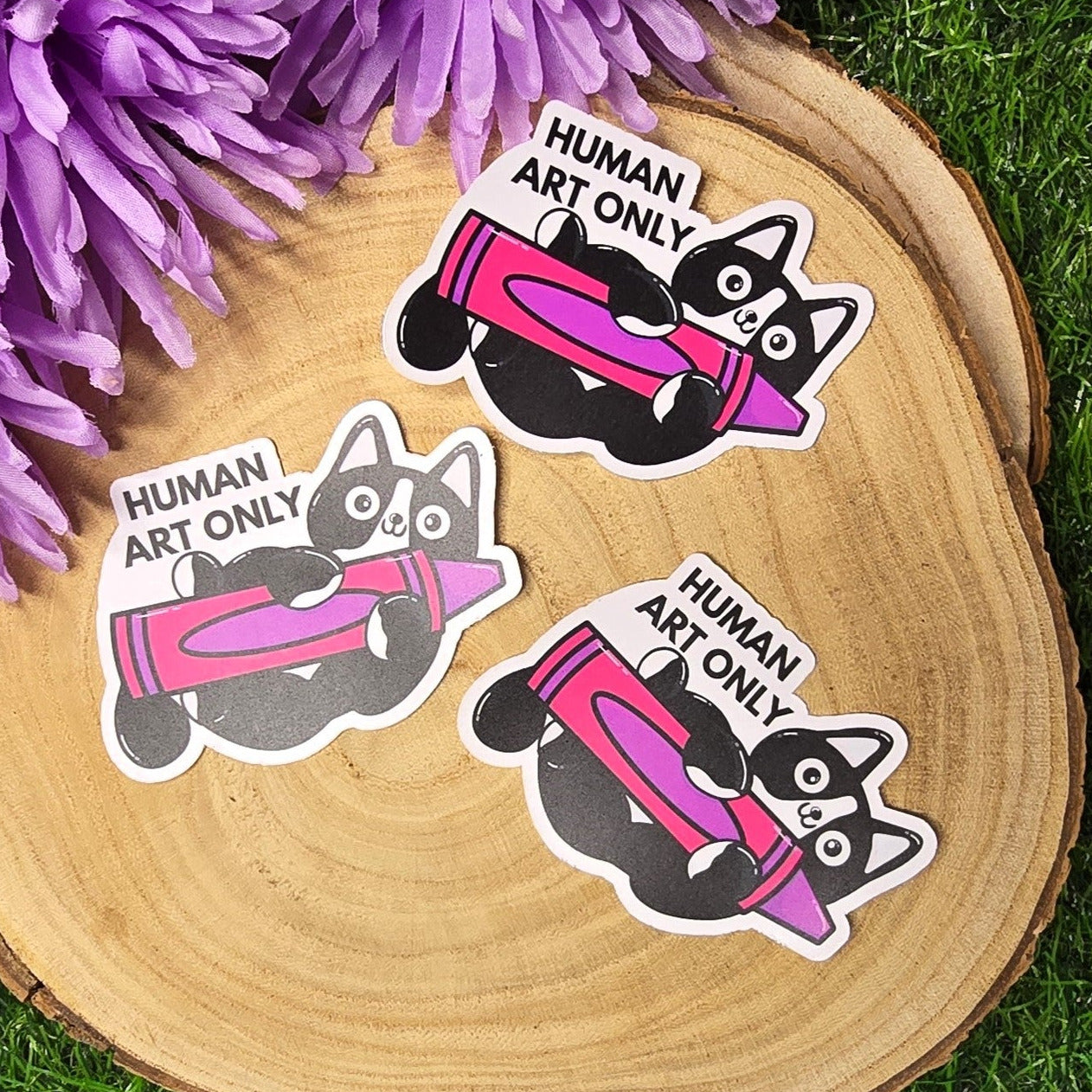 Human art only cat matte vinyl sticker showing black and white cat holding pink crayon, die cut waterproof handmade sticker 8cm UK