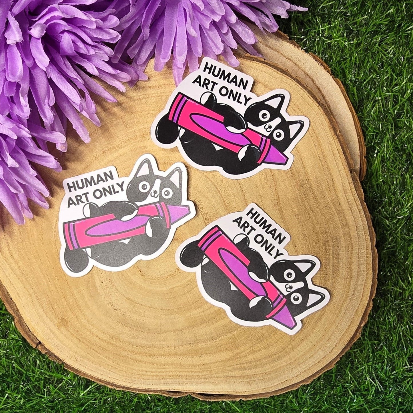 Human art only cat matte vinyl sticker showing black and white cat holding pink crayon, die cut waterproof handmade sticker 8cm UK