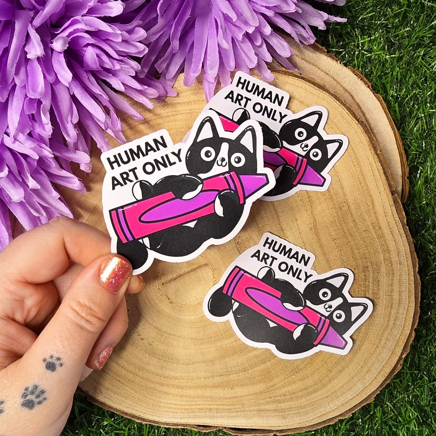 Human art only cat matte vinyl sticker showing black and white cat holding pink crayon, die cut waterproof handmade sticker 8cm UK