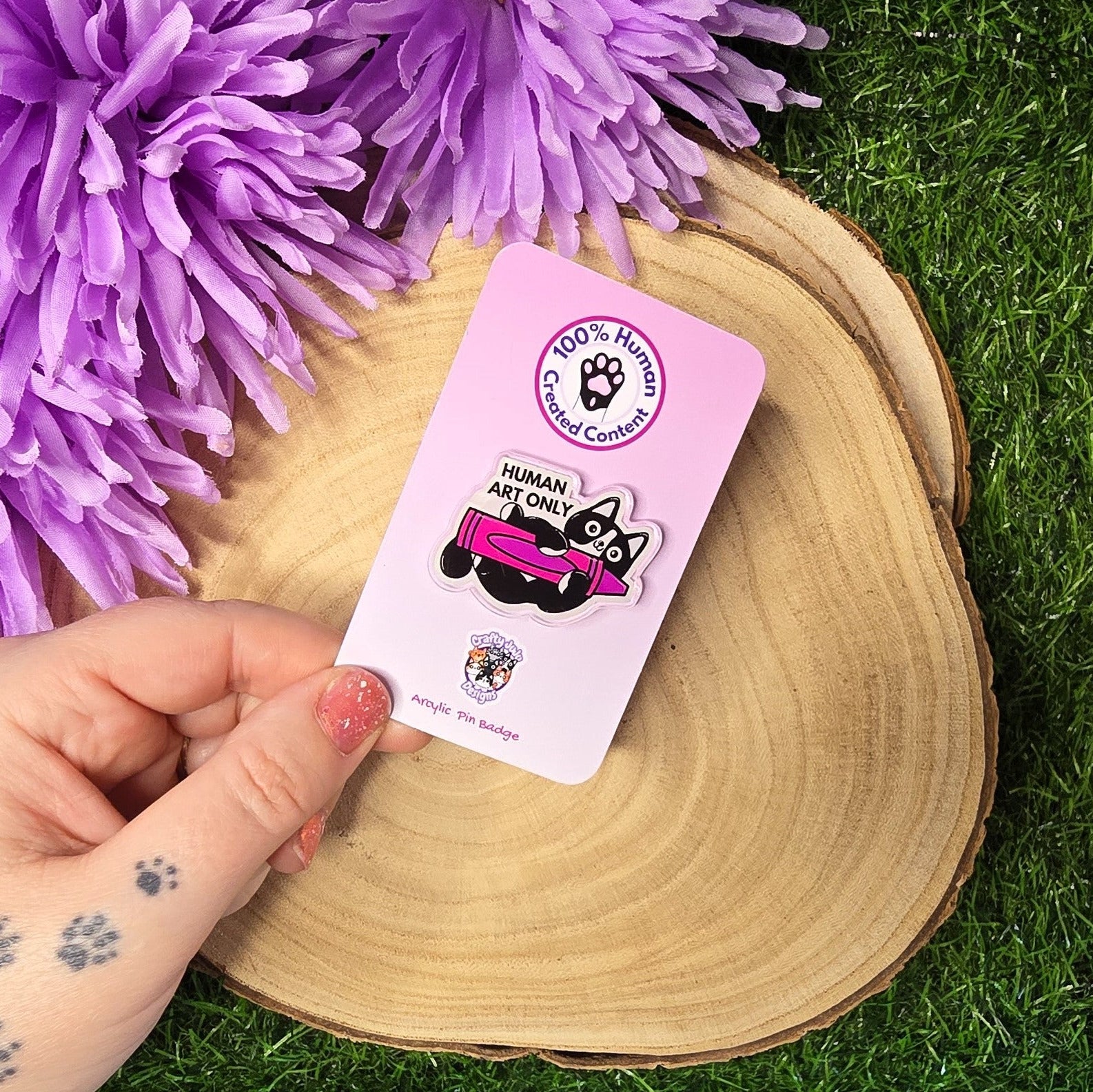Human art only acrylic pin badge showing black and white cat holding pink crayon, artist humour accessory 4cm UK