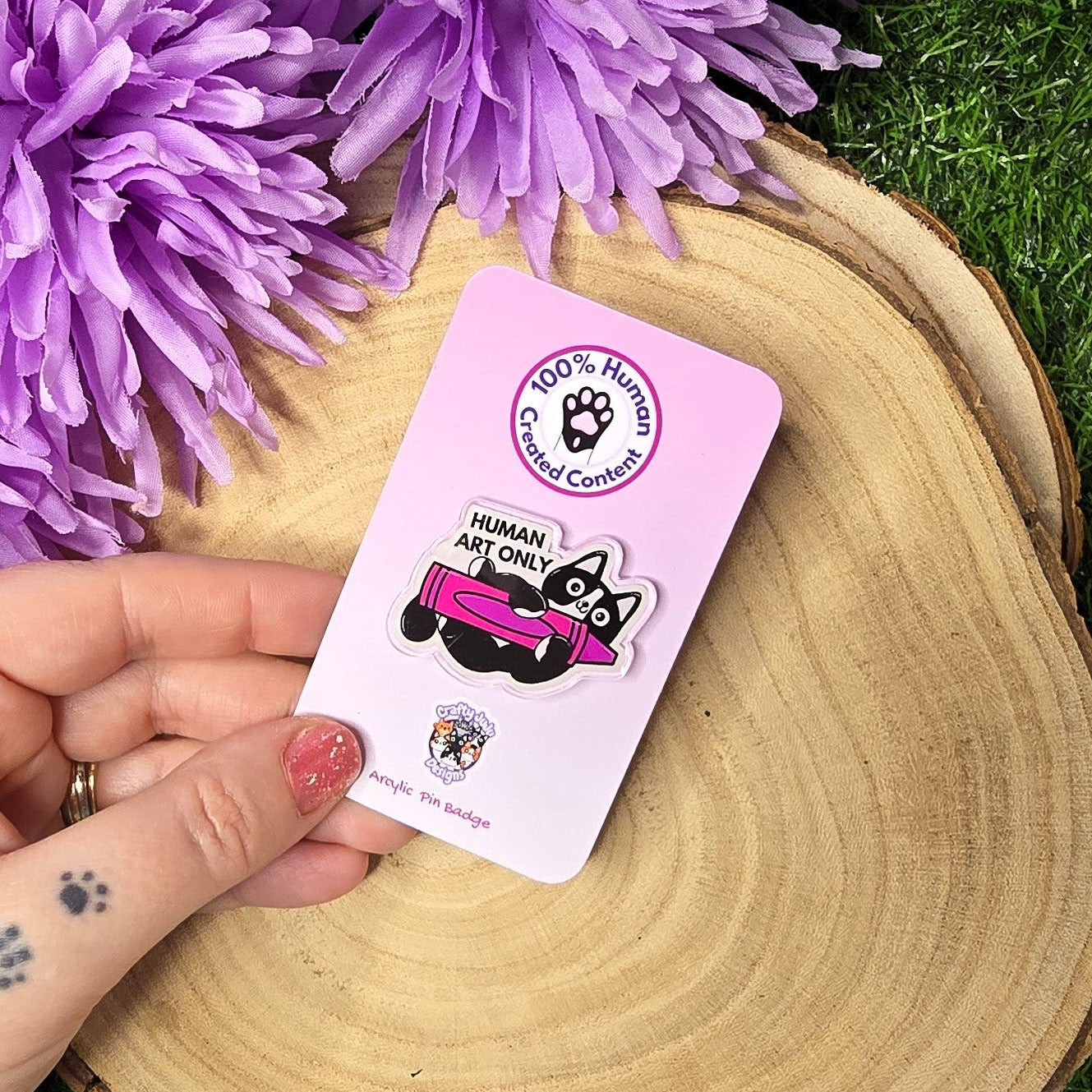 Human art only acrylic pin badge showing black and white cat holding pink crayon, artist humour accessory 4cm UK