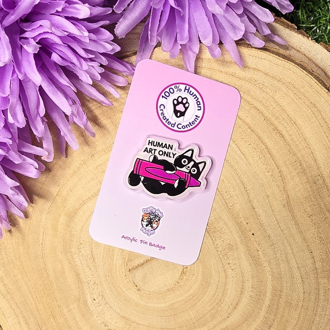 Human art only acrylic pin badge showing black and white cat holding pink crayon, artist humour accessory 4cm UK