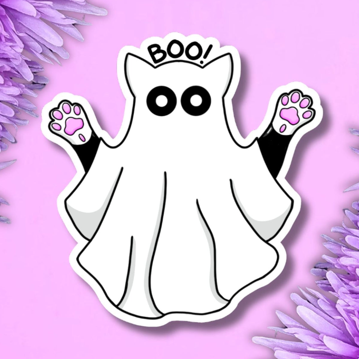 A cute cartoon ghost sticker with cat ears, black eyes, black paw pads, and pink paw prints, surrounded by purple flowers on a pink background.
