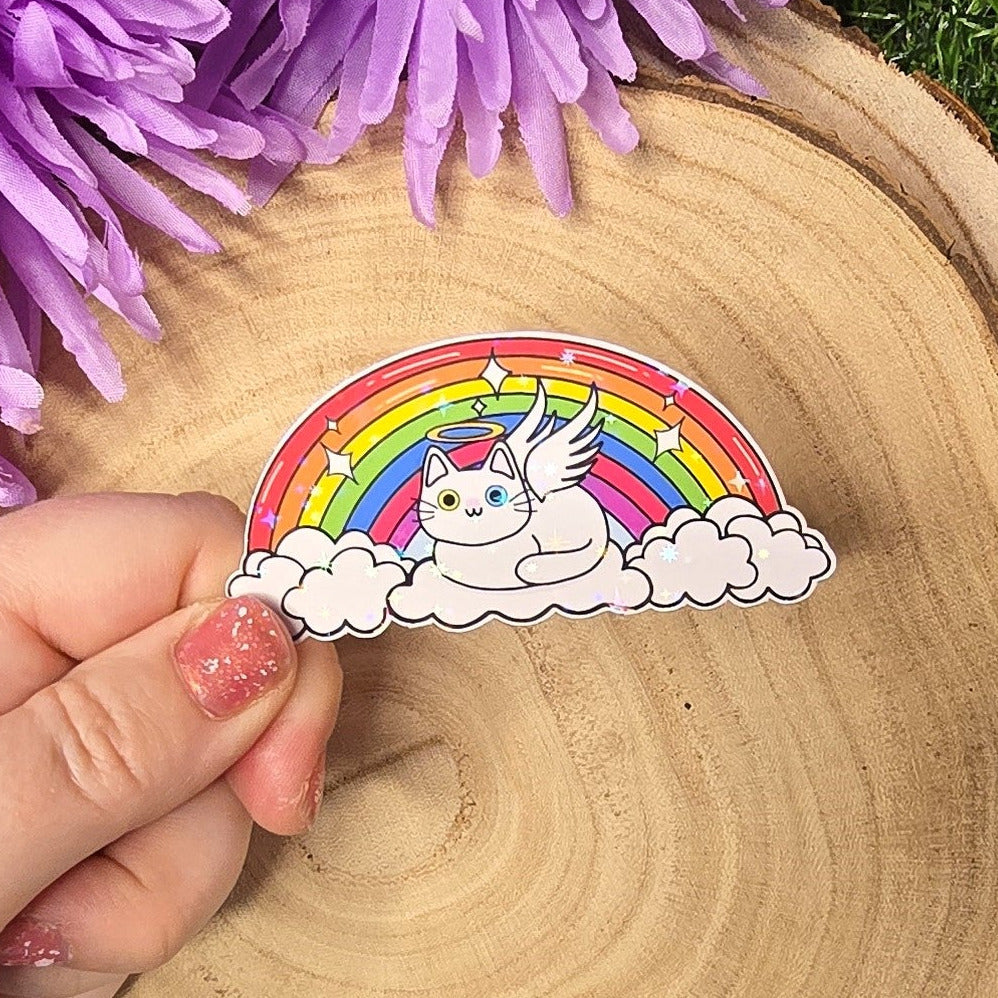 Holographic angel cat vinyl sticker resting on clouds under rainbow, memorial pet rainbow bridge design 8cm UK handmade