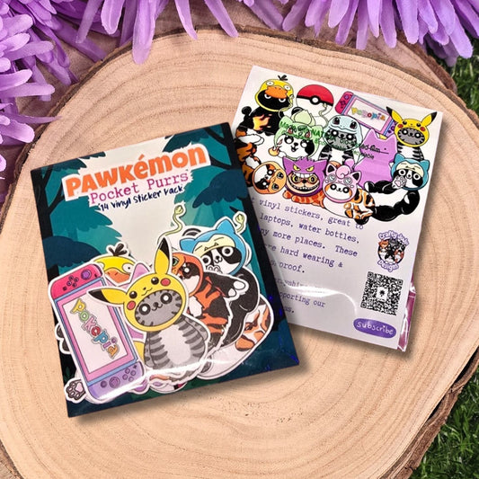Pawkémon Pocket Puzzles packaging with stickers on a wooden surface with purple flowers.