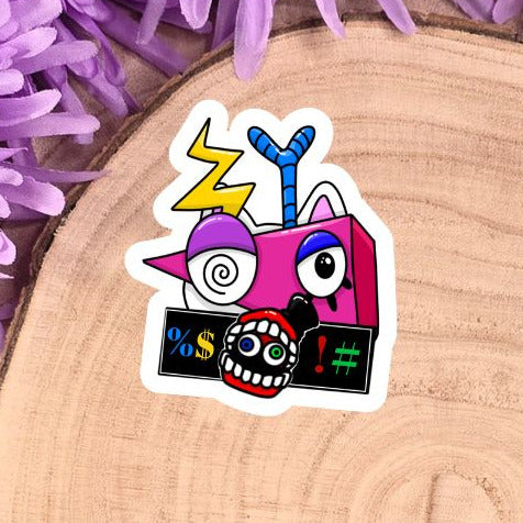 Colorful sticker on a wooden log with purple flowers in the background