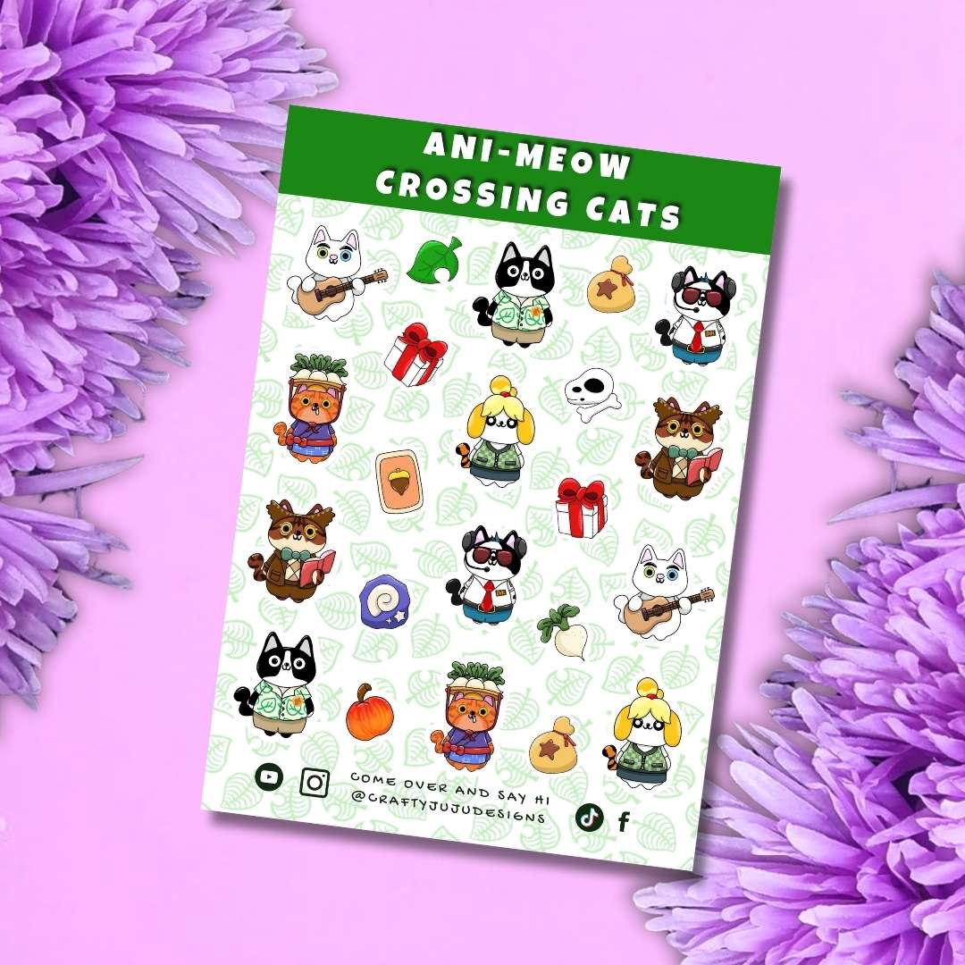 A sticker sheet titled 'ANI-MEOW CROSSING CATS' by @creativestudiosolutions, featuring various cute cartoon cat characters in different outfits and poses, styled on a pink background with purple flowers.
