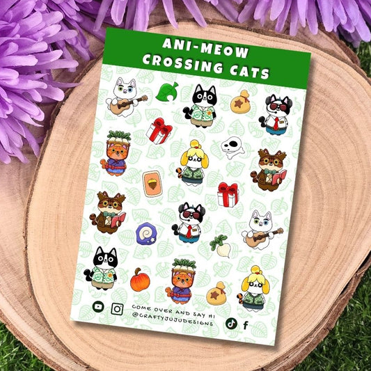 Sheet of 'Ani-Meow Crossing Cats' stickers with a green border on a wooden surface with purple flowers.