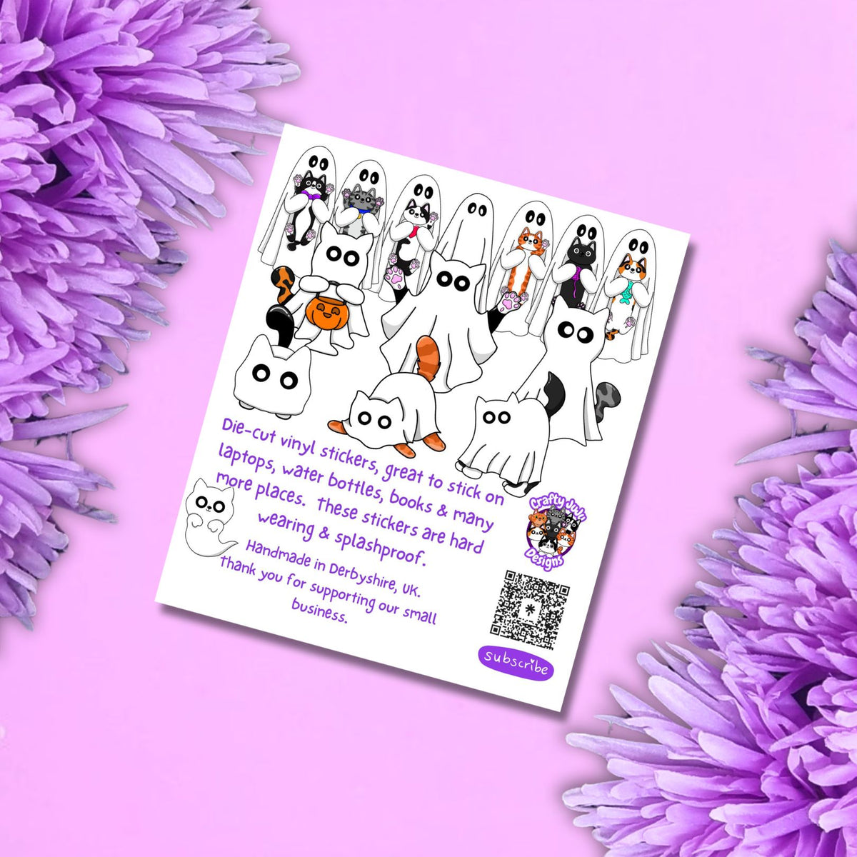 A white card displaying a set of 14 vinyl stickers titled 'GHOSTLY WHISKERS' with cartoon ghosts and cats, styled on a pink background with purple flowers.