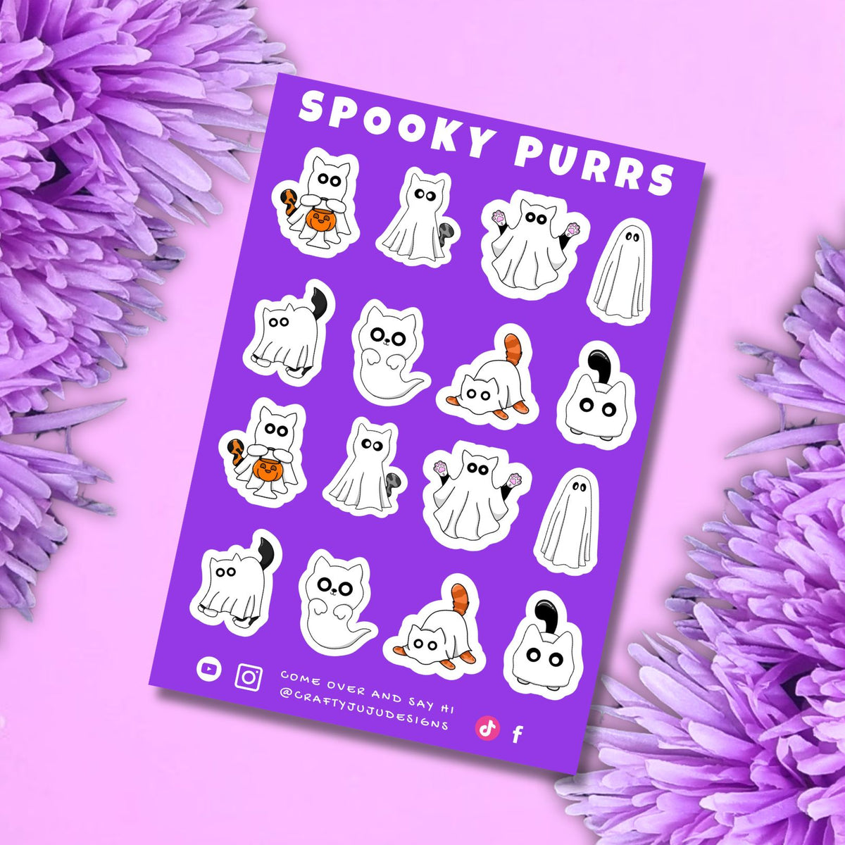 A purple sticker sheet titled 'Spooky Purrs' featuring cartoon cat and ghost Halloween designs, styled on a pink background with purple flowers.